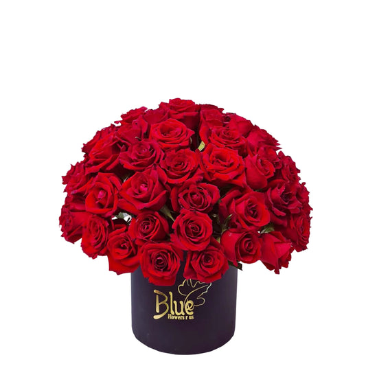Bouquet of red roses in a black box with 'Blue Flowers & Gifts' branding on a light gray background.